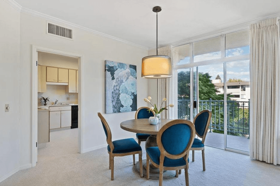 The Peninsula Regent - Unit 203 - Dining room with sliding glass doors to balcony